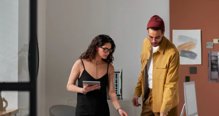 Two colleagues reviewing work together